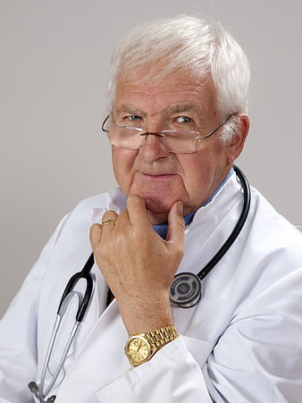 Senior male doctor with stethoscope in white coat