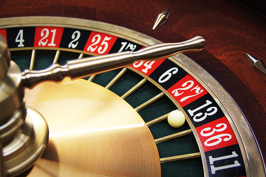 Close-up of a Roulette Wheel with Ball on Number 13