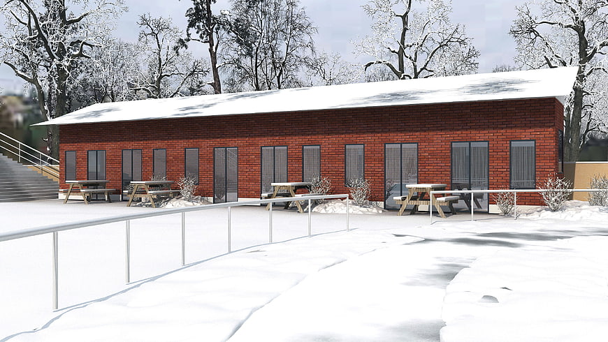 Modern red brick building exterior in winter snow