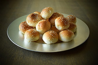 Golden Sesame Buns on Silver Plate