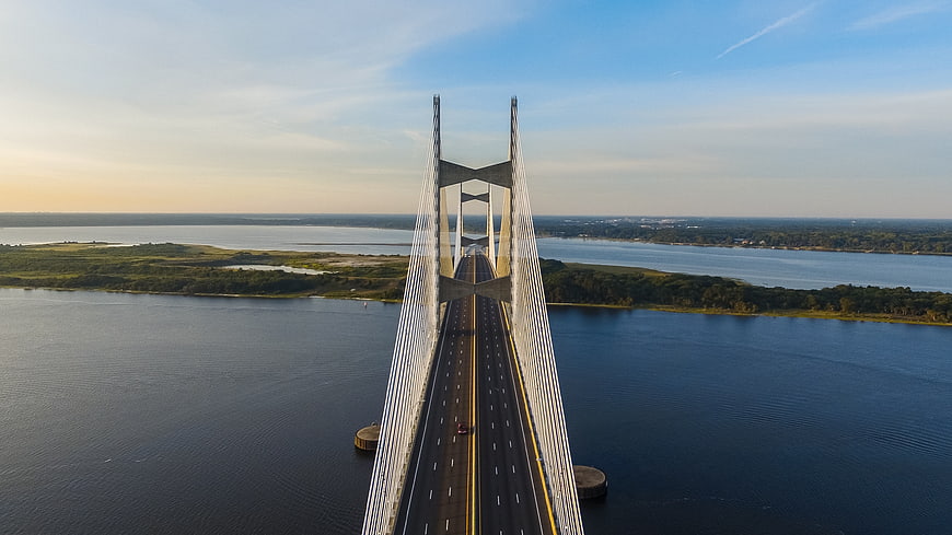 Aerial View of Modern Cable-Stayed Bridge Over Water