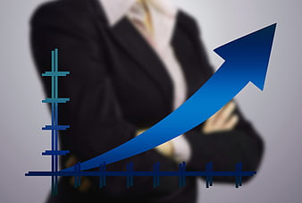 Businessman with rising growth arrow chart overlay