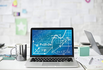 Laptop displaying mathematical formulas and geometric diagrams on a modern office desk