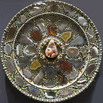 Ornate circular plate with colorful mineral inlay and gold detailing