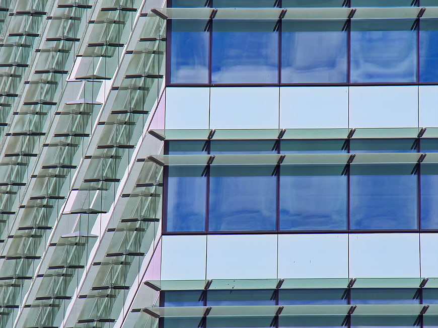 Modern Glass Building Facade with Blue Reflections