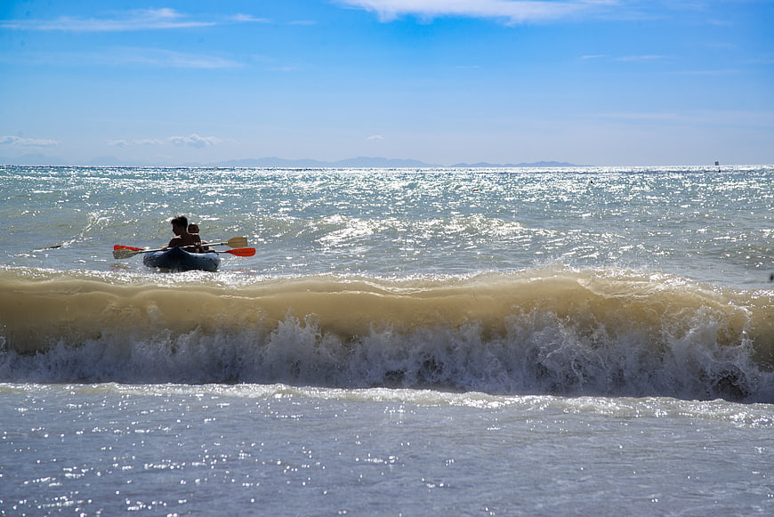 Kayaking in Ocean Waves on a Sunny Day