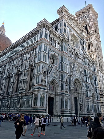 Florence Cathedral Duomo facade with tourists in Piazza del Duomo