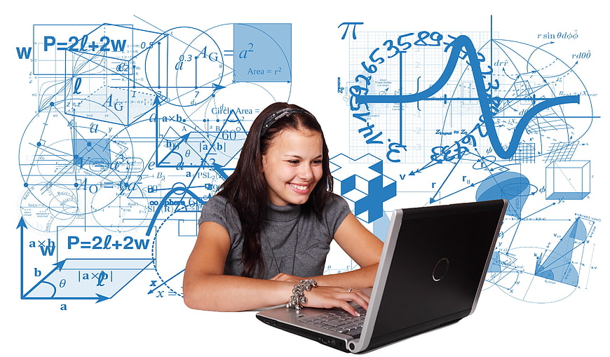 Teen girl studying math and science on laptop with formulas