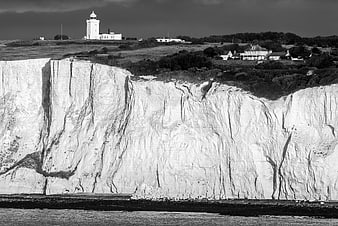 Dramatic Black and White Lighthouse on White Cliffs