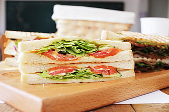 Fresh Club Sandwich With Lettuce And Tomato On Wooden Board
