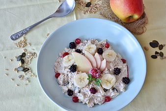 Healthy oatmeal porridge with fresh fruits and seeds