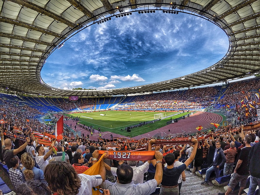 Wide-angle view of AS Roma fans cheering in Olympic Stadium
