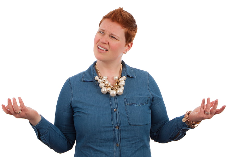 Confused Redhead Woman Shrugging with Questioning Expression