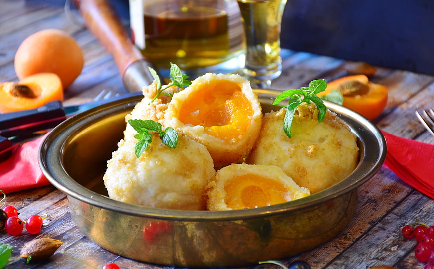 Apricot Dumplings with Mint Garnish on Rustic Wooden Table