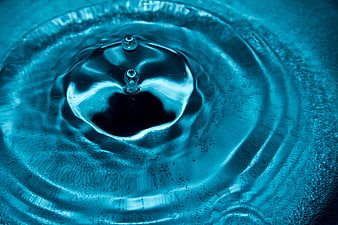 Abstract Blue Water Drop Splash with Ripples