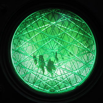 Close-up of Green Traffic Light Lens with Reflections
