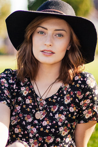 Portrait of Woman in Black Hat and Floral Dress