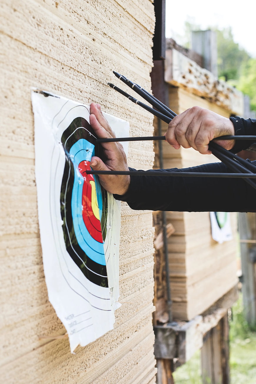 Archery target with arrows in bullseye