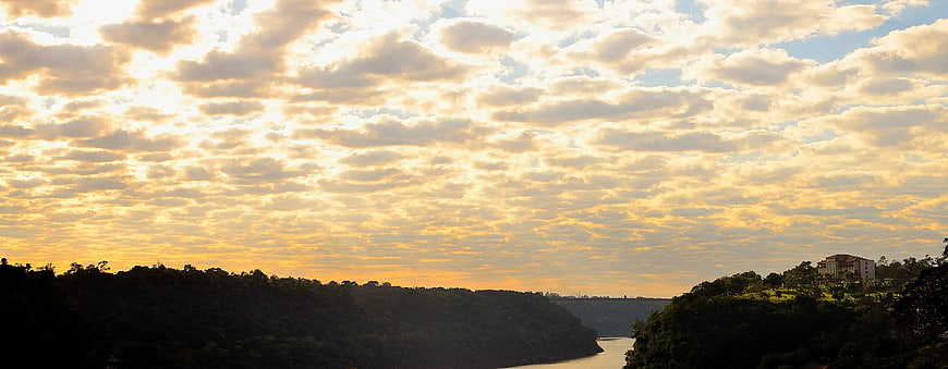 Panoramic River Valley at Golden Hour with Cloudy Sky