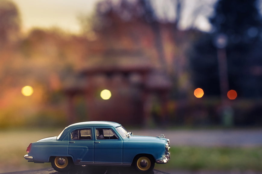 Blue Vintage Toy Car with Bokeh Background