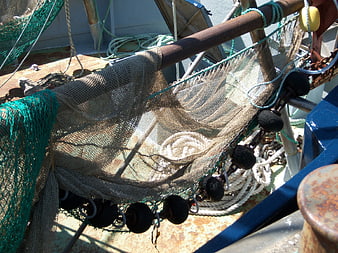 Fishing Net Detail On Rusty Boat Deck