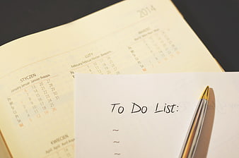 Handwritten To Do List on Paper with Pen and Calendar