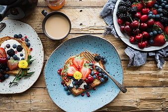 Overhead view of healthy breakfast toast with berries and coffee