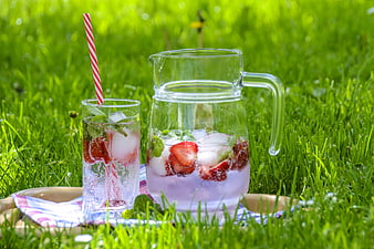 Refreshing Strawberry Mint Drink on Green Grass
