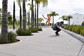 Businessman Skateboarding in Modern Corporate Park