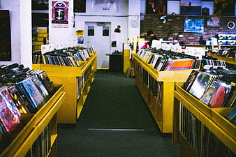 Vinyl Record Store Interior With Yellow Shelves And Music Albums