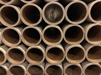 Stacked industrial metal pipes with circular cross-sections