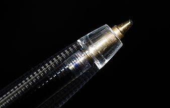 Macro Close-Up of Ballpoint Pen Tip on Black Background