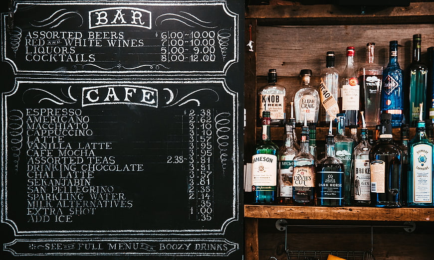 Chalkboard Menu and Liquor Bottles at a Rustic Bar