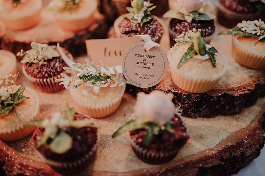 Rustic Wedding Cupcakes with Floral Decorations on Wooden Slices