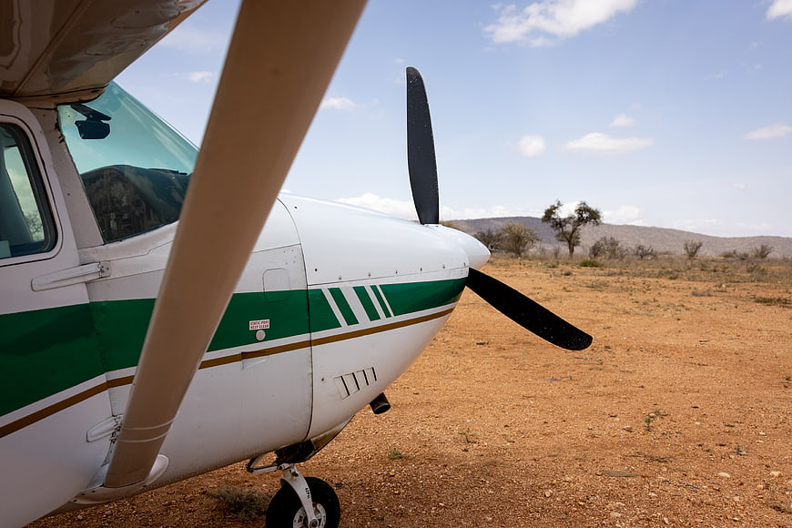 Small Propeller Plane on Red Dirt Runway