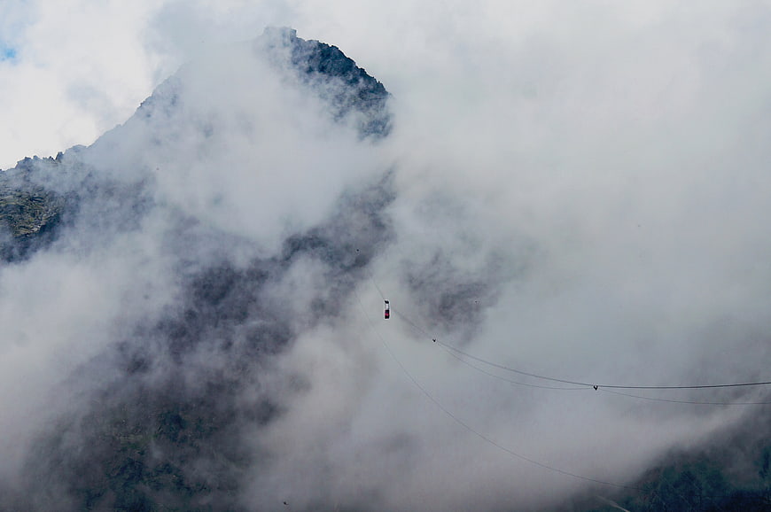 Cable Car Suspended in Thick Mountain Fog