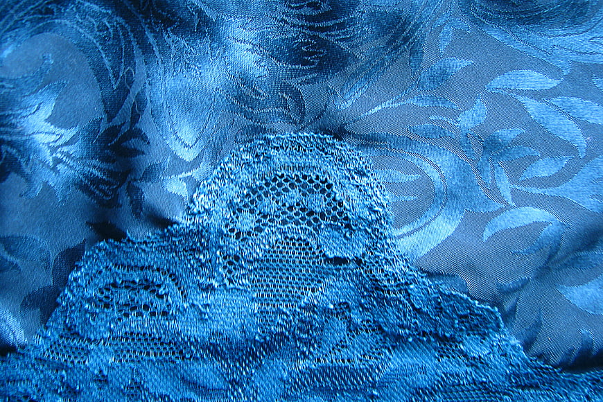 Blue Lace and Brocade Fabric Texture Close-Up