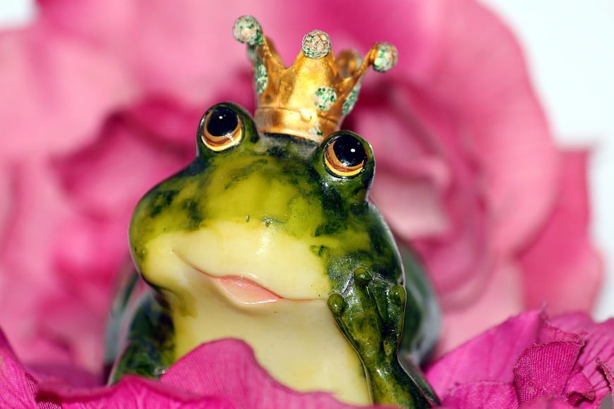 Green Frog Prince Figurine with Gold Crown on Pink Flower