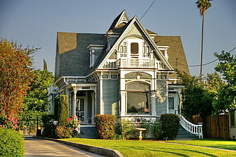 Beautiful Victorian House with Green Siding and White Trim