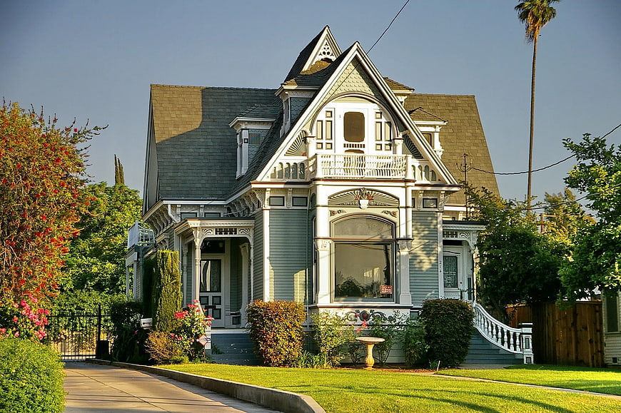 Beautiful Victorian House with Green Siding and White Trim