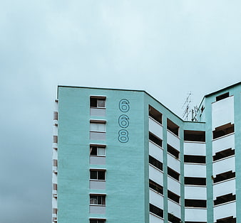 Minimalist Teal Apartment Building with Number 668