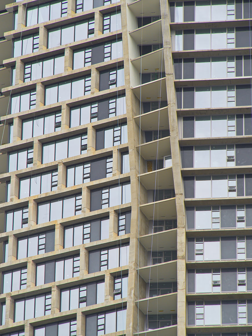 Modern Concrete Apartment Building Facade with Windows