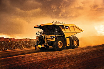Yellow Mining Truck Driving on Dirt Road