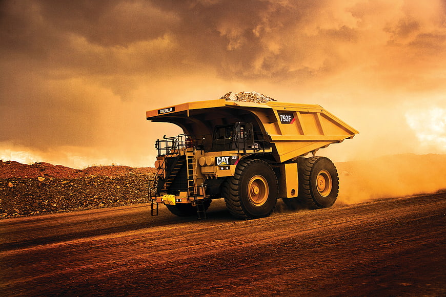 Yellow Mining Truck Driving on Dirt Road