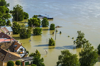 Aerial View of Severe River Flooding Submerging Residential Neighborhood