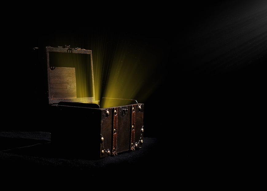 Vintage Wooden Treasure Chest with Golden Light Beams