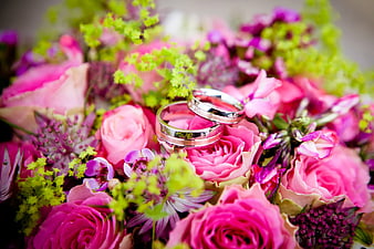 Wedding Rings on Pink and Purple Floral Bouquet