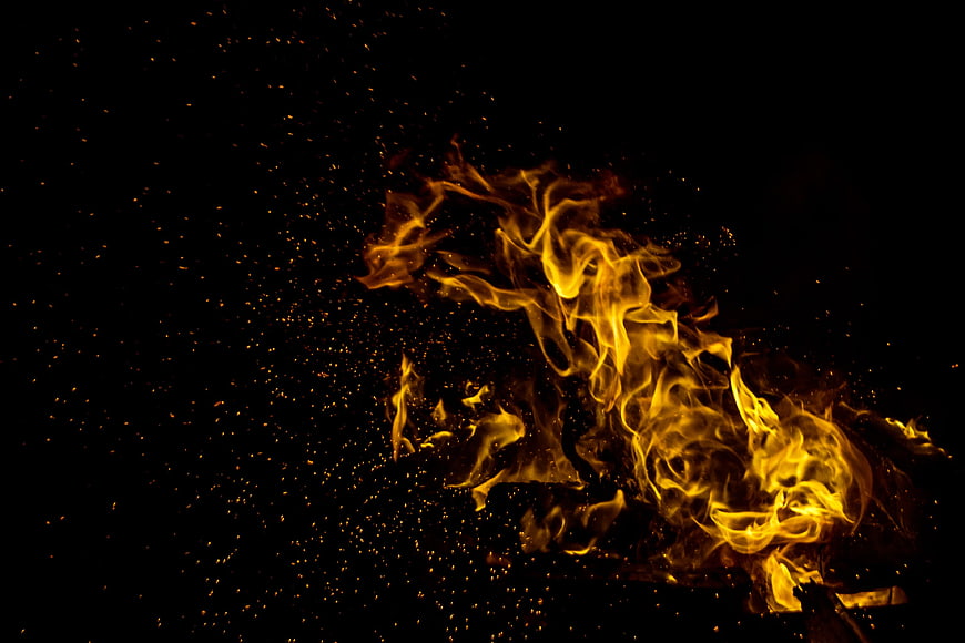 Vibrant Fire Flames And Sparks On Black Background