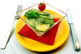 Fresh Cucumber Salad With Cherry Tomato And Parsley On Yellow Plate