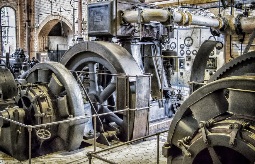 Vintage Industrial Generators in Historic Power Plant Interior